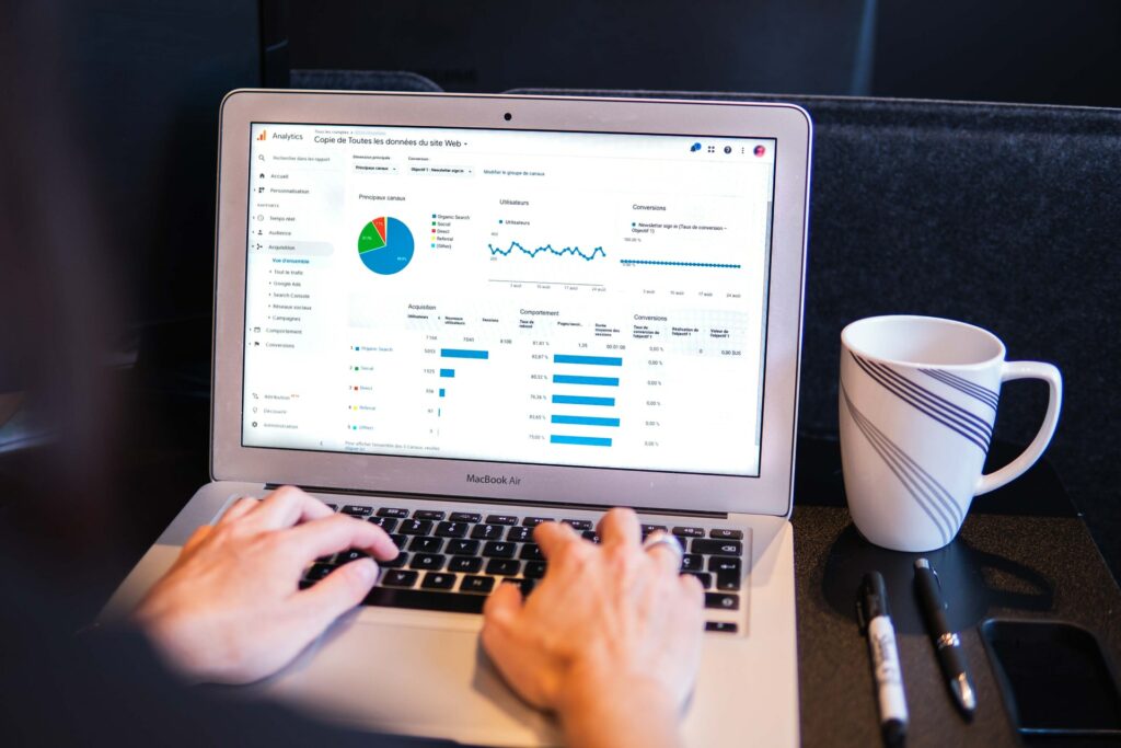 A man working on a laptop using Google Analytics