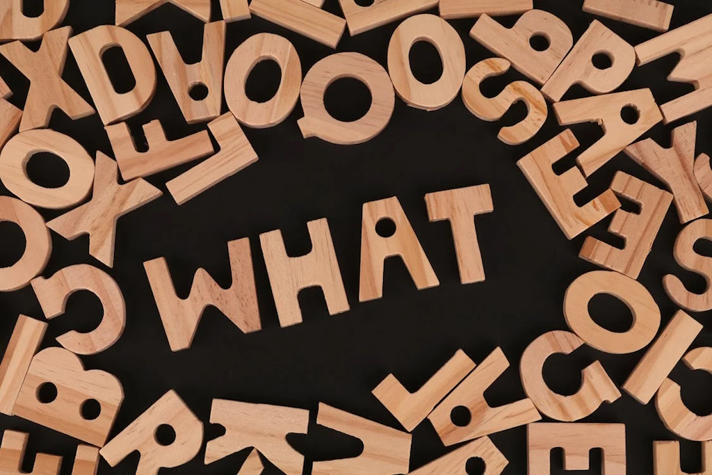 wooden puzzle highlighting the word 'what'